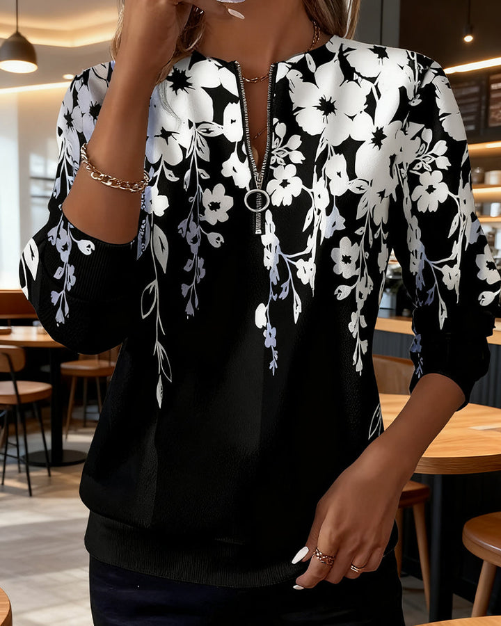 Brisella - Florale Bluse mit Reißverschluss
