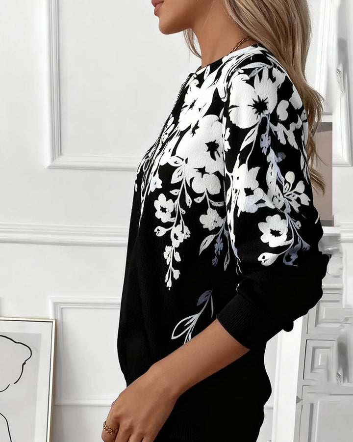 Brisella - Florale Bluse mit Reißverschluss