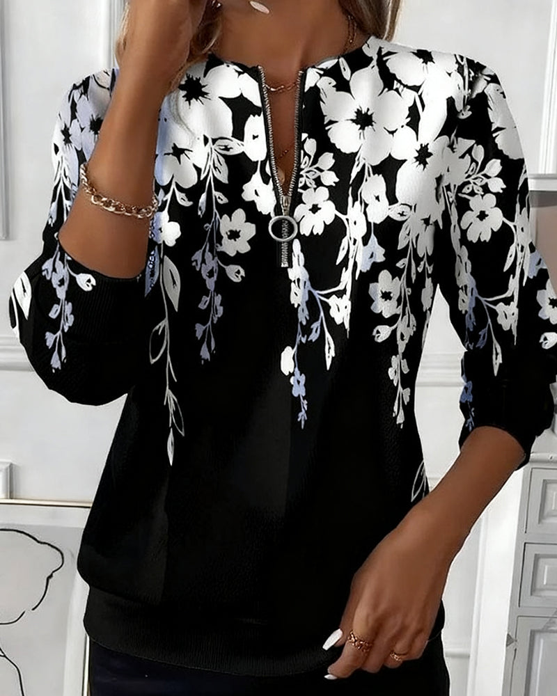 Brisella - Florale Bluse mit Reißverschluss
